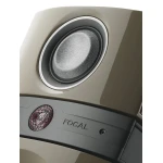 Close-up of a beige FOCAL speaker with a large circular driver visible in the frame.