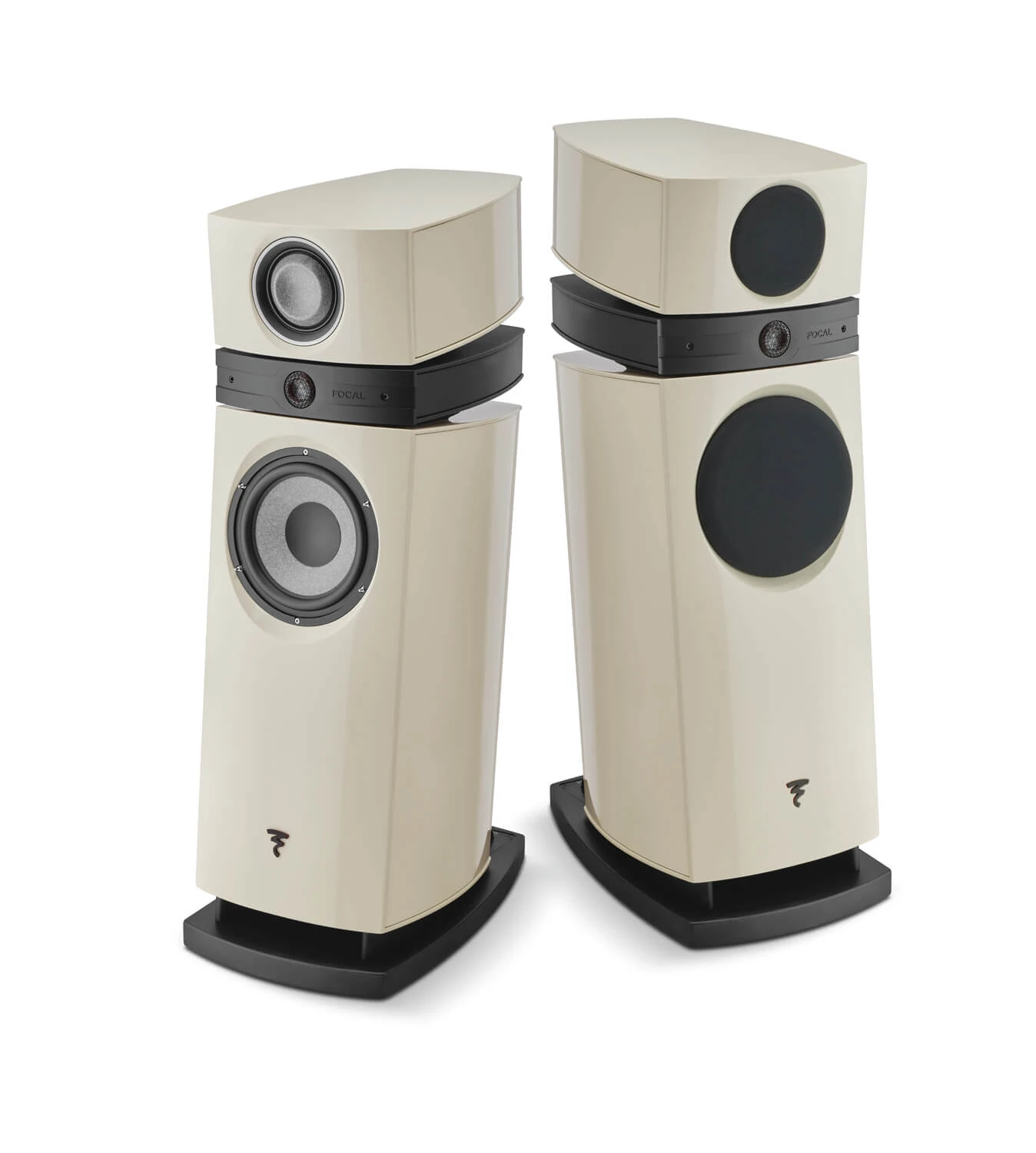 Pair of cream-colored floorstanding loudspeakers with large circular woofers and smaller drivers, mounted on black stands against a white background