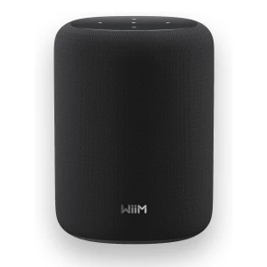 Black cylindrical smart speaker with fabric mesh and top touch controls, branded Wiim.