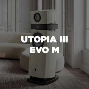 Tall white floor-standing speaker in a modern living room with white paneled walls; bold text overlay reads 'UTOPIA II EVO M'