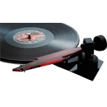 Record on a black turntable with a red translucent tonearm and stylus ready to play.