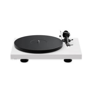 A modern white turntable with a large black platter and tonearm on the right side, set against a white background, viewed from the front-left angle, close up.