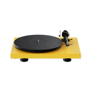Yellow turntable with a large black platter and tonearm on the right, isolated on white background.