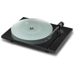Turntable with a frosted glass record on a black acrylic base and a silver-tonearm set for playing vinyls (no needle on groove).