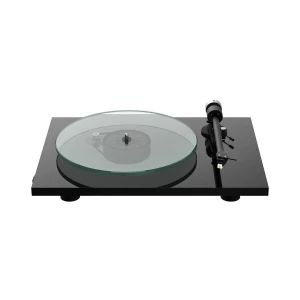 Turntable with a glass platter on a black base and a tonearm on the right side.