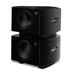 Two black subwoofer cabinets stacked on top of each other, each with a large circular driver and a small digital display on the front panel.