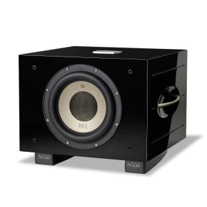 High-gloss black subwoofer with a large cream-colored driver center marked REL Acoustics, mounted on gray S/550 stands.