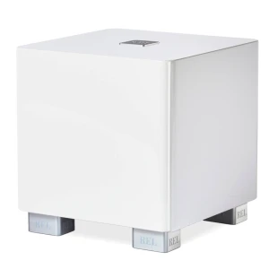 White rectangular subwoofer on four small chrome feet with REL branding visible