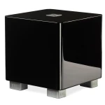 Glossy black subwoofer on silver feet labeled REL, with a small chrome badge on top edge.