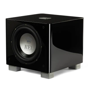 Black glossy subwoofer on silver REL feet, with a silver driver logo visible on the front panel