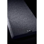 Close-up of dark heather grey fabric with a small black 'T+A' brand tag at the corner.