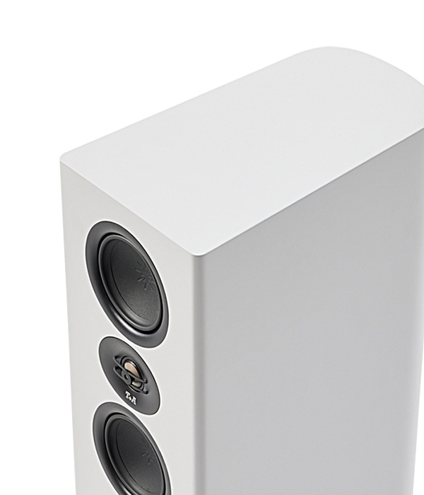 White floor-standing speaker with two large round drivers and a small centered midrange/tweeter between them.