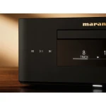 Close-up of a Marantz audio component with playback icons on the left and a display reading '8 TRACK' on a wooden surface.