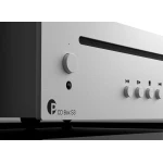 Close-up of a silver brushed-metal CD player front panel with a large round dial and playback controls; CD Box S3 branding visible on the left.