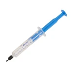 Disposable syringe with blue plunger and capped needle, angled to the left.