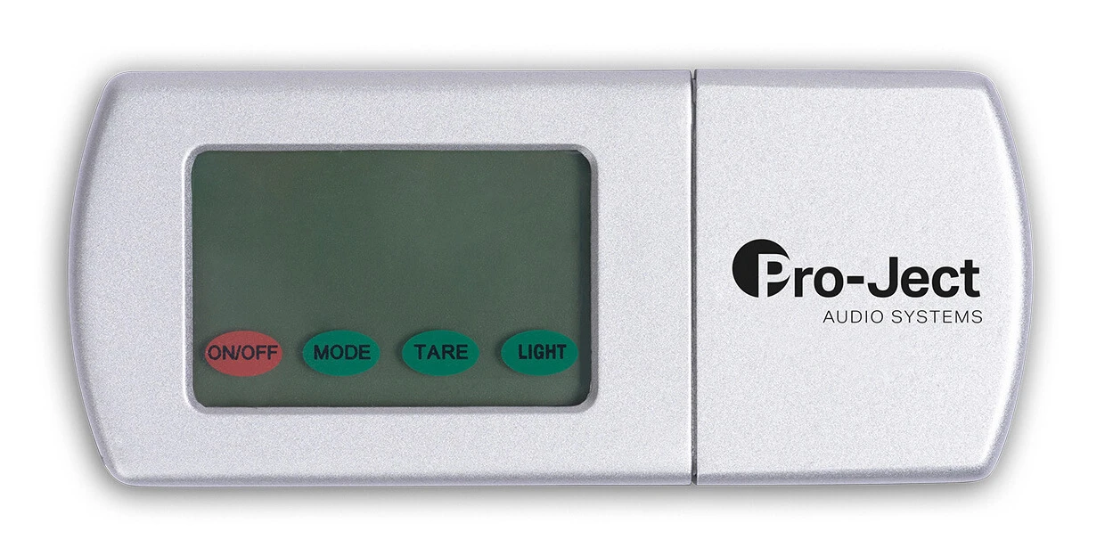 pro-ject-measure-it-s2 - Enigma High Fidelity Audio Silver Pro-Ject audio system remote with display and four labeled buttons: ON/OFF, MODE, TARE, LIGHT.