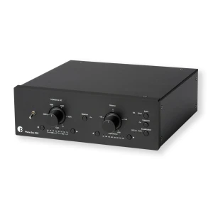 Front view of a black Phono Box RS2 phono preamplifier with two large knobs (Gain and Balance/Capacitance), small switches, and input indicators on the panel for turntable signal processing.