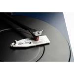 Close-up of a turntable tonearm with a white Pro-Ject cartridge resting on the record platter.