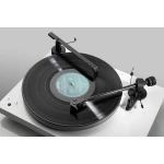 Modern turntable with a spinning vinyl record and long tonearm on a white surface, showcasing a sleek, minimalist setup.