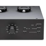 Front panel of an audio amplifier with a large central knob and multiple small buttons/controls labeled Input (RCA, XLR), Subsonic, Loading Ohms, Loading pF, and Gain dB. Two cooling fan housings are visible on top.
