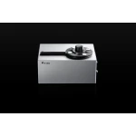 Pro-Ject audio component in a silver rectangular case with a large circular top dial on a black background.