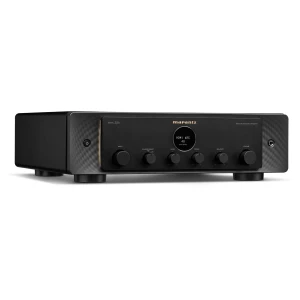 Front view of a black Marantz networked amplifier with multiple knobs (input, source direct, bass, treble, balance) and a large volume knob on the right, standing on short feet.
