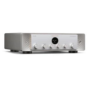 Front view of a silver Marantz network integrated amplifier with multiple knobs and a central circular display on a brushed metal face.