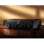 Marantz integrated amplifier on a dark wooden surface, front panel with knobs and a central display reading 'PHONO -53.0'